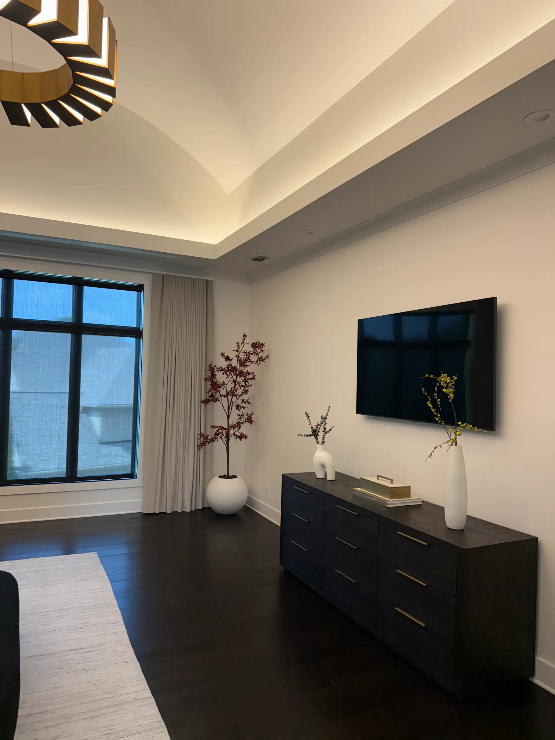 Luxury master bedroom with custom built-ins and accent wall
