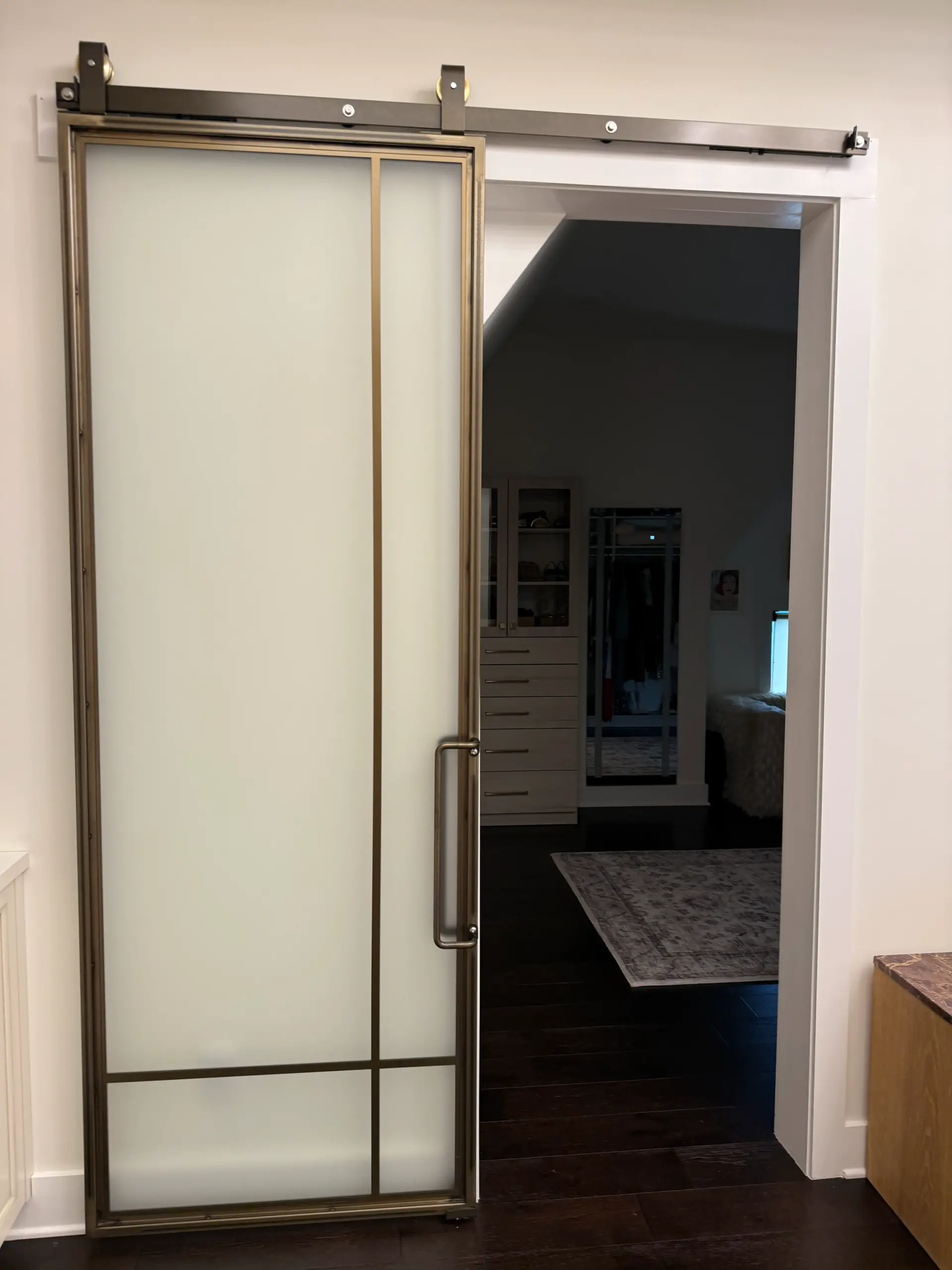 His and hers custom closet with dual vanity zones and cabinetry
